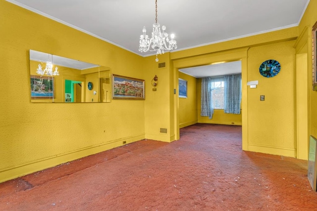 carpeted empty room featuring a notable chandelier and crown molding