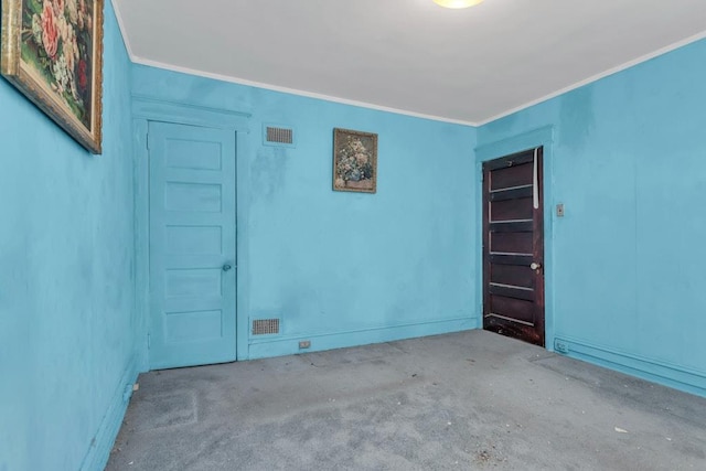 spare room featuring crown molding