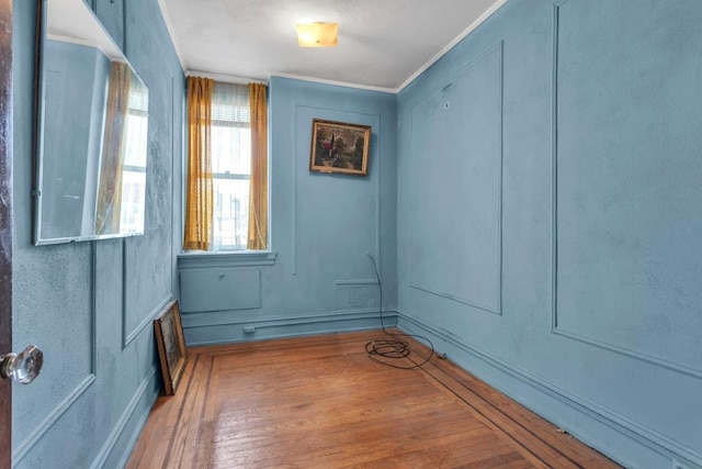 unfurnished room featuring hardwood / wood-style flooring