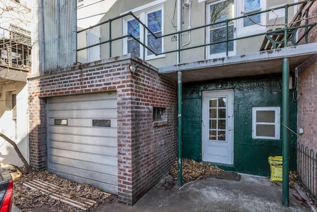 view of exterior entry with a garage