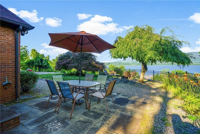 view of patio with a water view