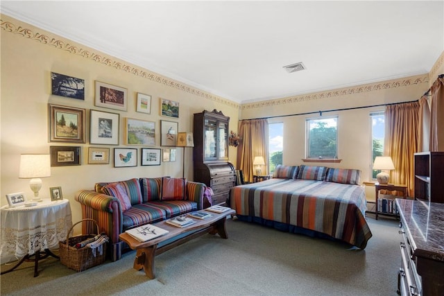 carpeted bedroom with ornamental molding