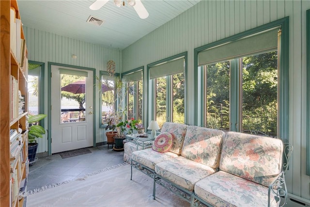 sunroom / solarium featuring ceiling fan and a healthy amount of sunlight