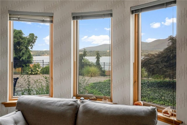 entryway featuring a water and mountain view