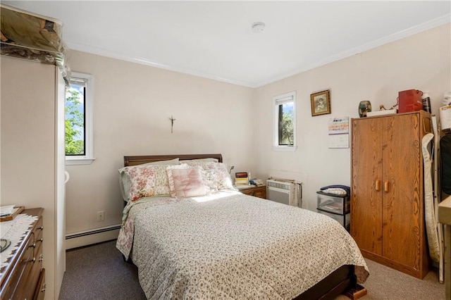 bedroom featuring crown molding, carpet flooring, and a baseboard heating unit