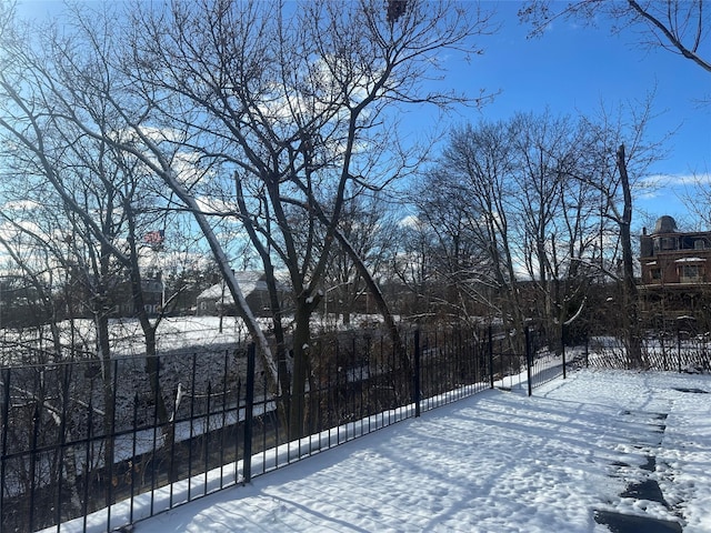 view of yard layered in snow