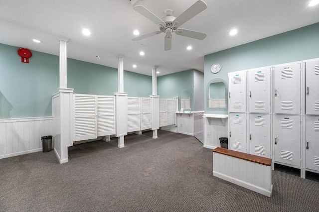 interior space with ceiling fan