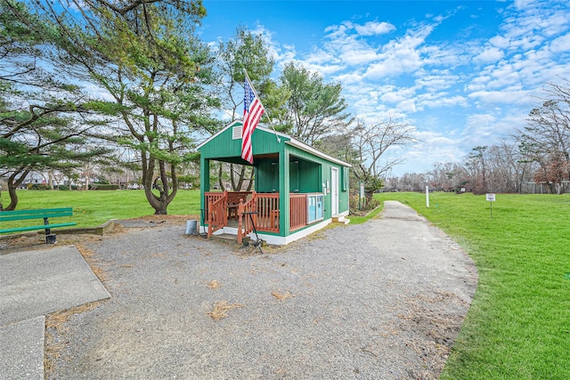 view of outbuilding with a lawn