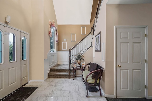 foyer featuring a high ceiling