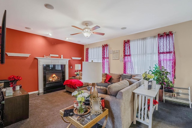 carpeted living room with ceiling fan