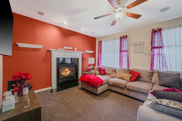 living room featuring carpet flooring and ceiling fan