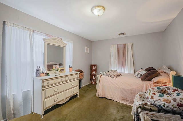 bedroom featuring dark colored carpet