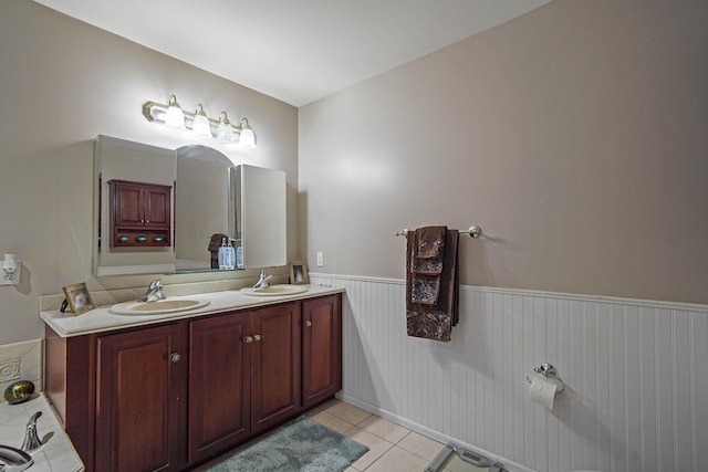 bathroom with tile patterned flooring and vanity