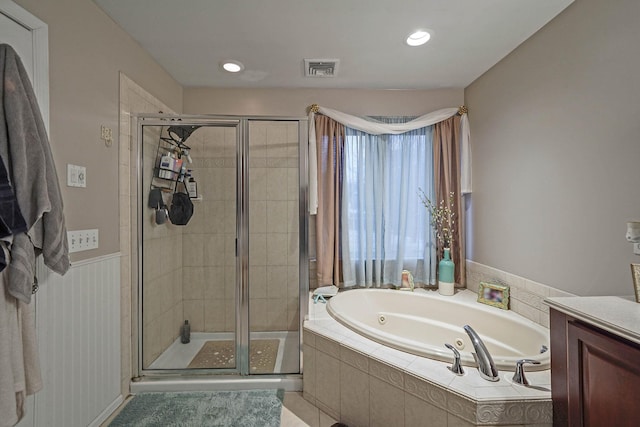 bathroom with independent shower and bath and vanity