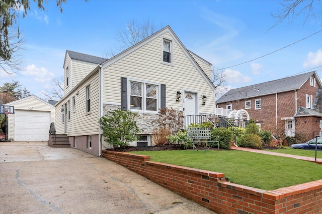 view of front of property featuring a garage, an outdoor structure, and a front yard