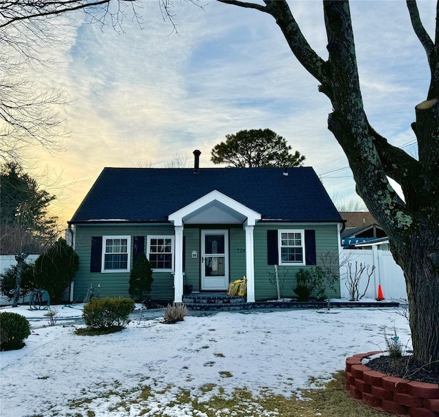 view of front of house with fence