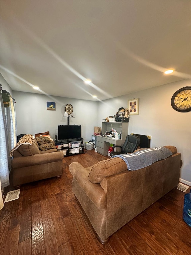 living room with visible vents and dark wood-style flooring