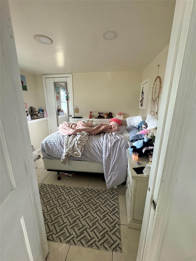 bedroom featuring light tile patterned floors