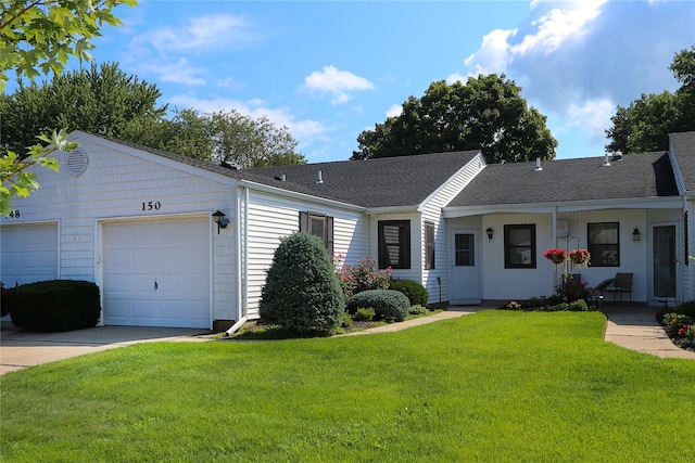 ranch-style home featuring a garage and a front lawn