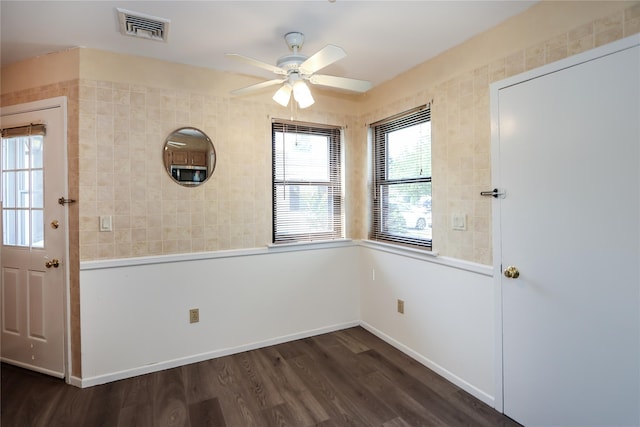 interior space with dark hardwood / wood-style floors and ceiling fan