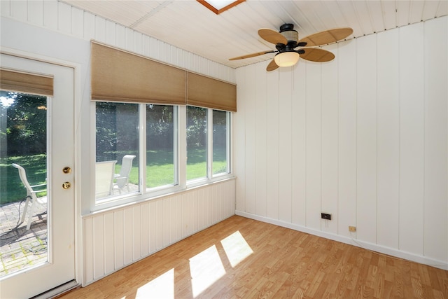 spare room featuring ceiling fan and light hardwood / wood-style flooring