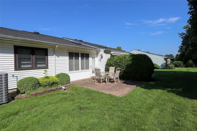 view of yard featuring central AC unit and a patio area