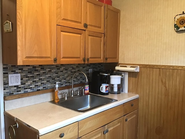 kitchen featuring tasteful backsplash and sink