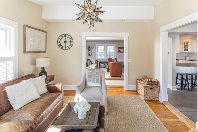 living room with wood finished floors and baseboards