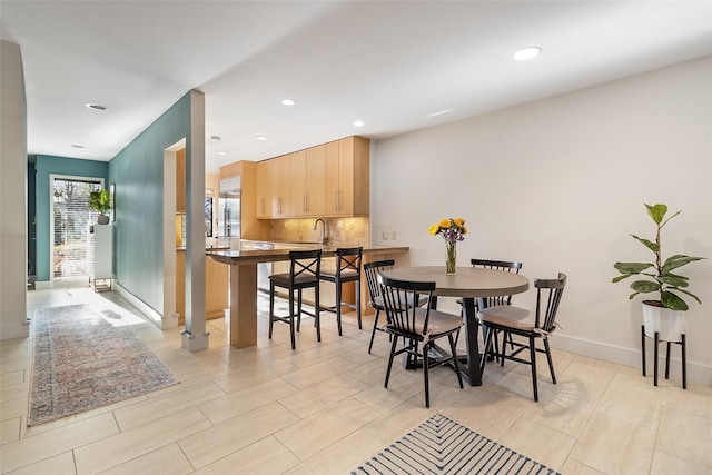 dining area featuring sink