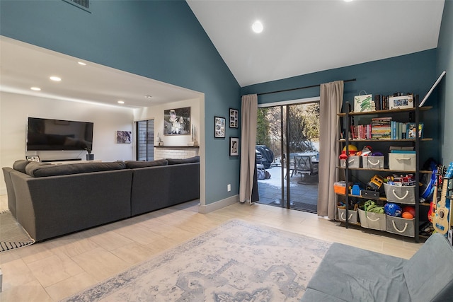 living room with high vaulted ceiling