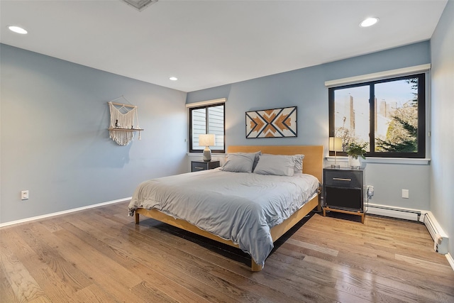 bedroom with light hardwood / wood-style floors