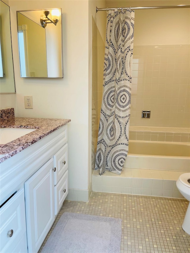 bathroom featuring vanity, toilet, curtained shower, and tile patterned flooring