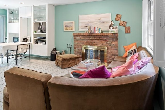 living room featuring light tile patterned floors and a fireplace