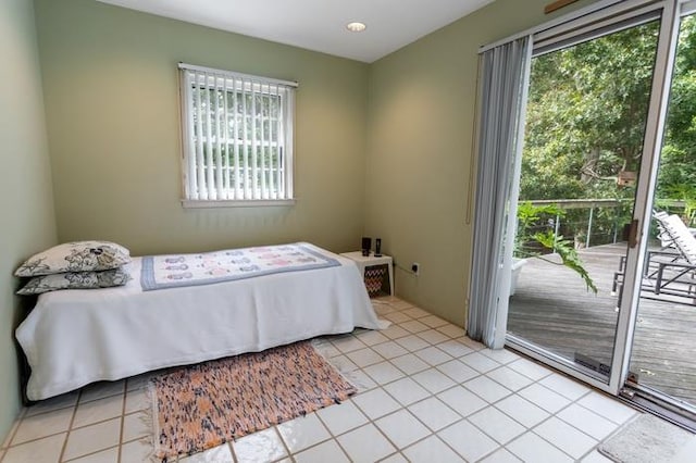 tiled bedroom featuring access to outside