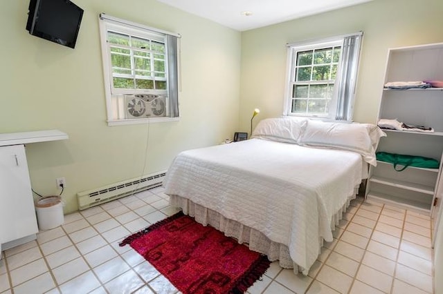 tiled bedroom featuring baseboard heating