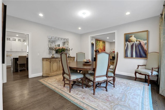 dining room featuring dark hardwood / wood-style flooring