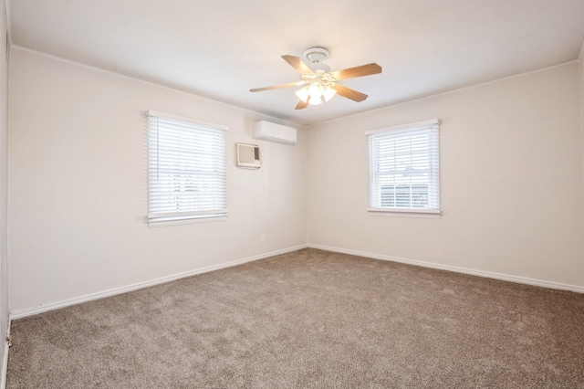 carpeted spare room featuring ceiling fan and an AC wall unit