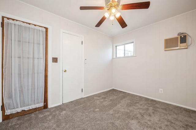 carpeted empty room with a wall mounted air conditioner, ornamental molding, and ceiling fan