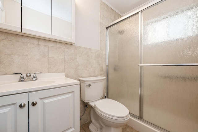 bathroom with walk in shower, tile walls, vanity, and toilet