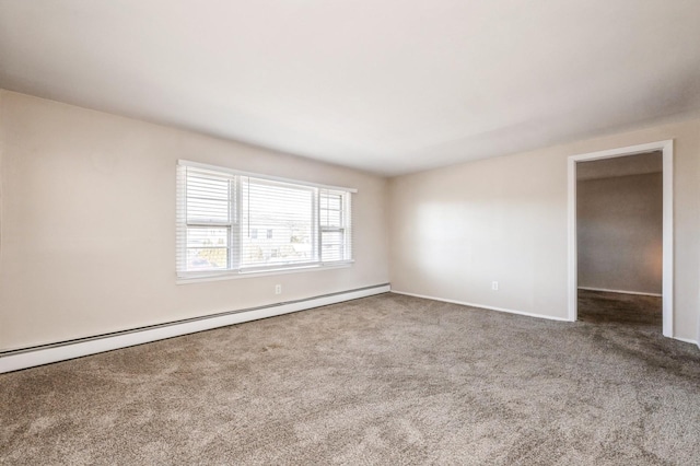 empty room featuring a baseboard radiator and carpet flooring