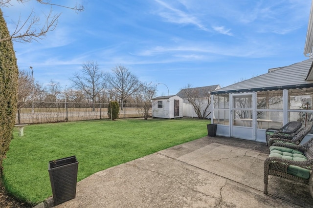 view of yard with a shed and a patio area