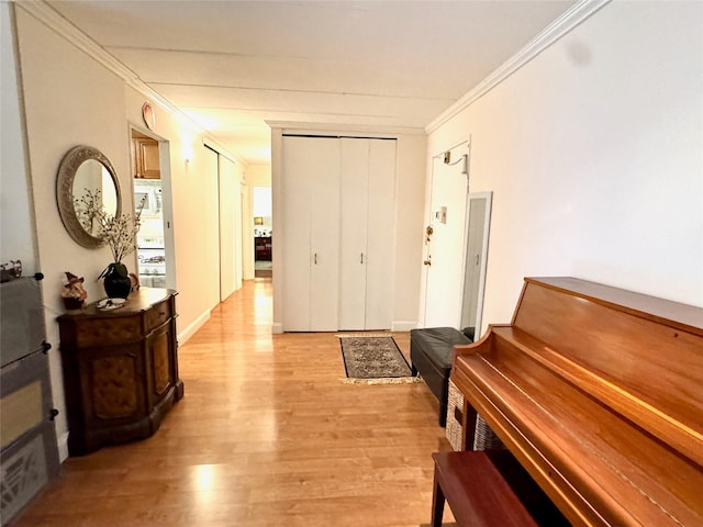 misc room with crown molding and light wood-type flooring