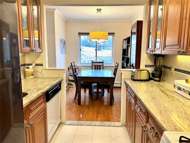 kitchen featuring white dishwasher, pendant lighting, ornamental molding, and light stone countertops