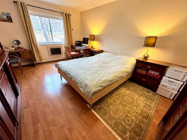 bedroom with wood-type flooring