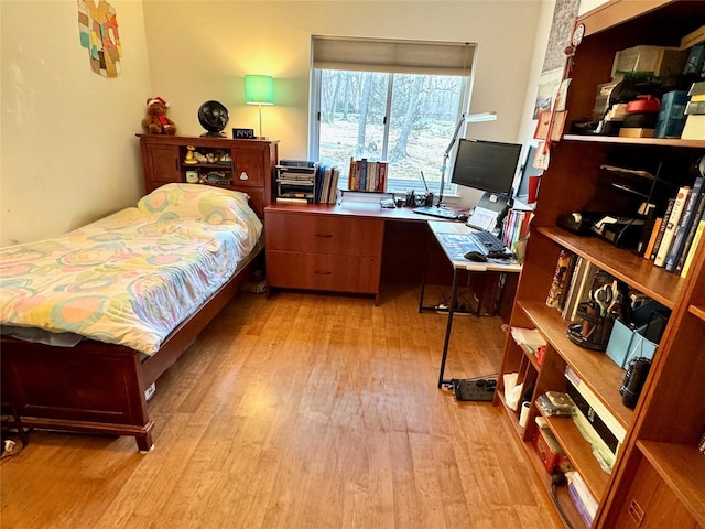 bedroom with light wood-type flooring