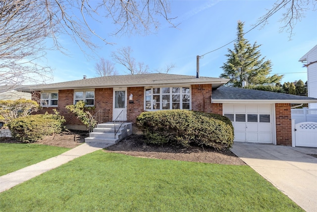 ranch-style house with a garage and a front lawn