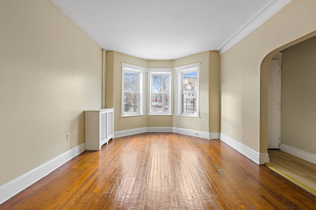 spare room with hardwood / wood-style flooring