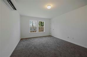 carpeted empty room with a wall mounted AC