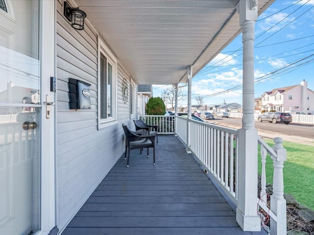 wooden terrace with a porch