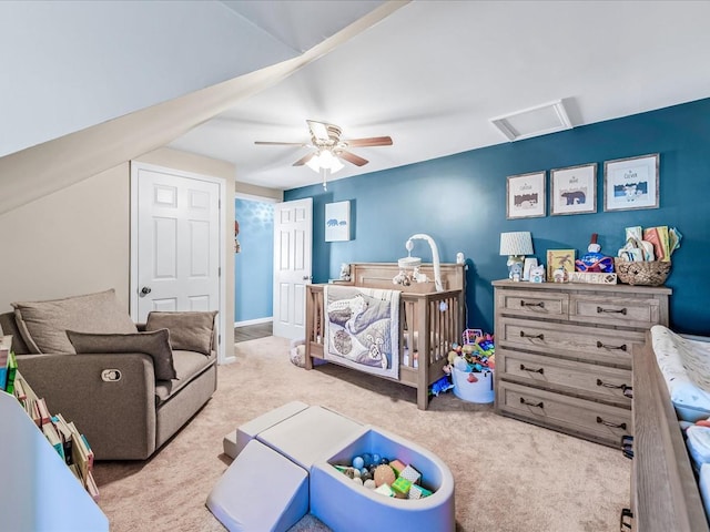 bedroom featuring light colored carpet and ceiling fan